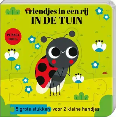 Kartonboek met Puzzelstukken in de tuin